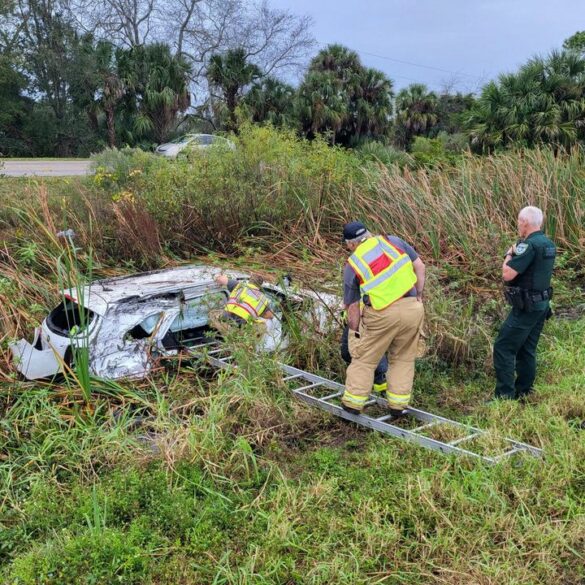 Deputies rescue family and save christmas after car submerged in canal - photo licensed by shore news network.