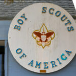 Big wooden sign on a building stating Boy Scouts of America