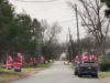 Entire Street in North Jersey is lined with Dozens of Huge Inflatable Santas