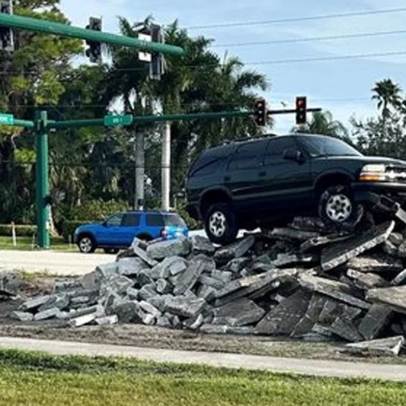 Reckless driver ends up atop pile of concrete after making dangerous u-turn - photo licensed by shore news network.