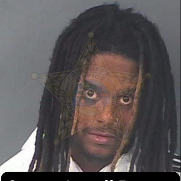 Man arrested for shooting into occupied home, missing target - photo licensed by shore news network.