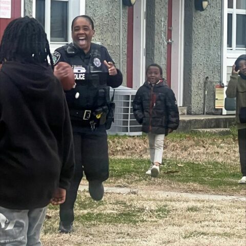 Newport news officer joins local youth for super bowl weekend neighborhood football game - photo licensed by shore news network.