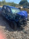 Child among three to safely exit after train struck car on tracks