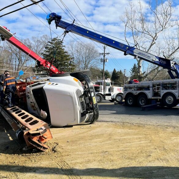 Boom truck overturns in gloucester township - photo licensed by shore news network.
