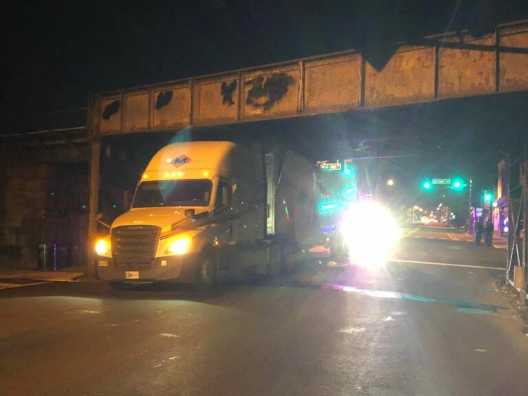 Tractor trailer stuck under overpass in north jersey - photo licensed by shore news network.