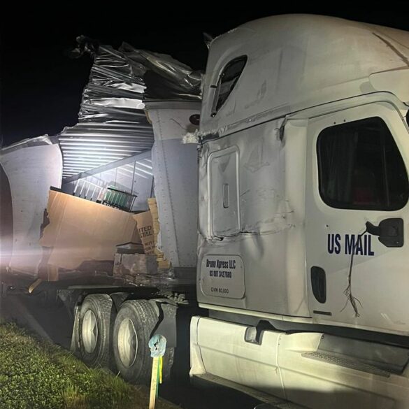 Mail scattered across highway after postal carrier involved in crash with semi - photo licensed by shore news network.