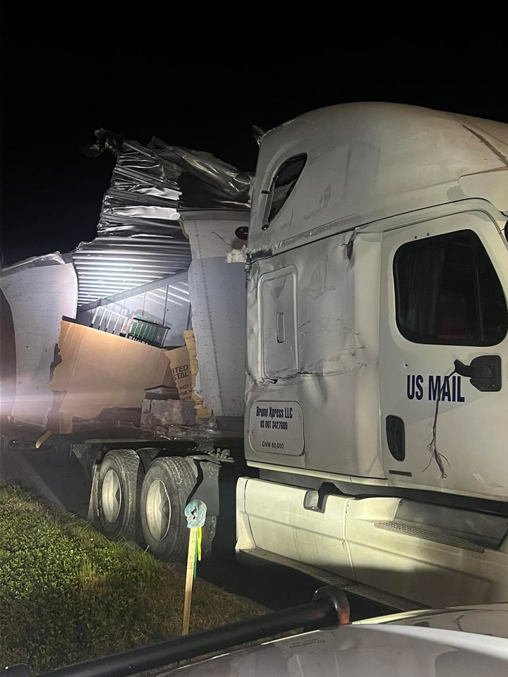 Mail Scattered Across Highway After Postal Carrier Involved in Crash with Semi