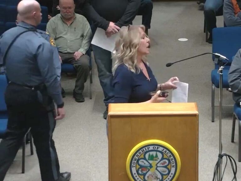 Woman gets police escort out of jackson council meeting after slanderous comments - photo licensed by shore news network.