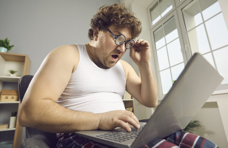 A-man-using-a-laptop-for-online-trolling