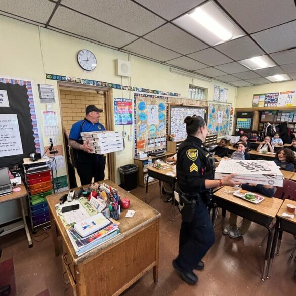 Belleville police officers host pizza party for reading challenge with local students - photo licensed by shore news network.