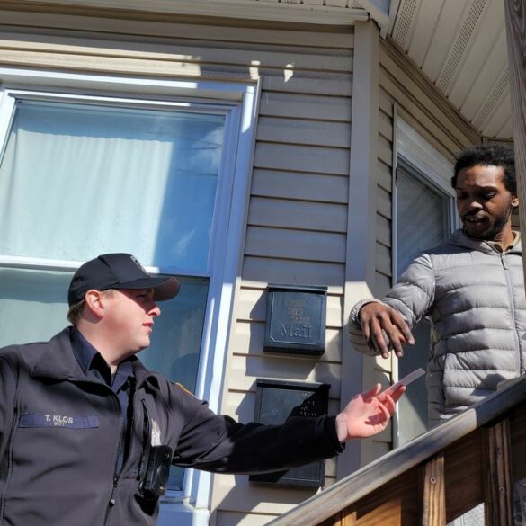 Paterson police introduce contact cards to foster community relations - photo licensed by shore news network.