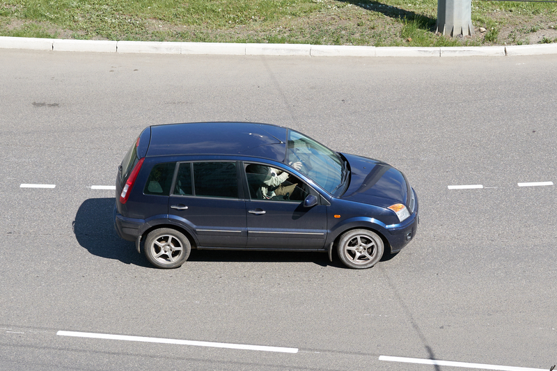 Ford Fusion on city road.