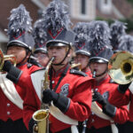 High School Marching Band Performing in Parade