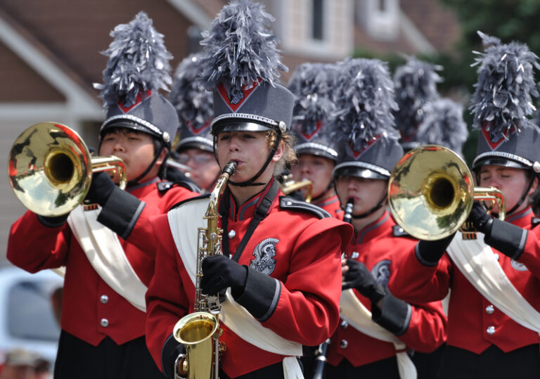 High school marching band performing in parade