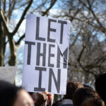 People taking part in the protest march against new immigration laws at Battery Park in New York City.