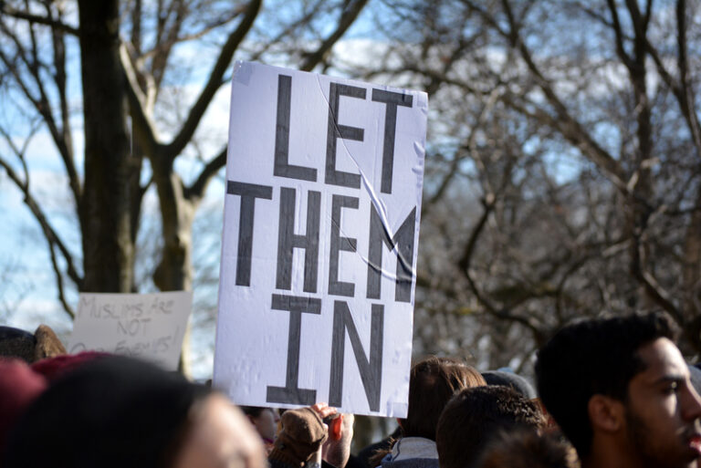 People taking part in the protest march against new immigration laws at battery park in new york city.