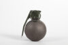 Photo of baseball type grenade on white background