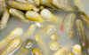 Pickled cucumbers in a barrel with brine