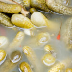 Pickled cucumbers in a barrel with brine