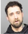 Highway crew finds ankle bracelet that leads police to wanted fugitive