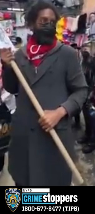 Woman Violently Attacked by Man Carrying Sign in Times Square