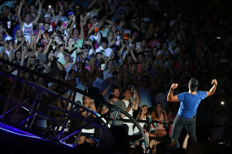 Luke bryan slips and falls on stage, fan's phone cited - photo licensed by shore news network.
