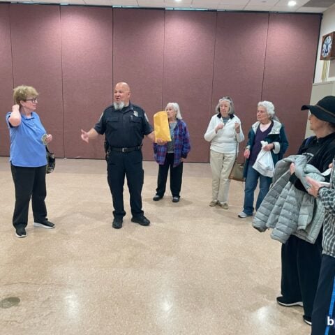 Boston police officers have coffee with a cop session for seniors - photo licensed by shore news network.