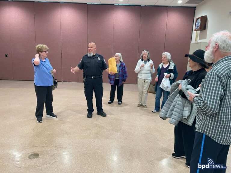 Boston police officers have coffee with a cop session for seniors - photo licensed by shore news network.