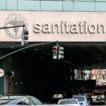 Cars drive under the NYC Sanitation Department building on the West Side of Manhattan.