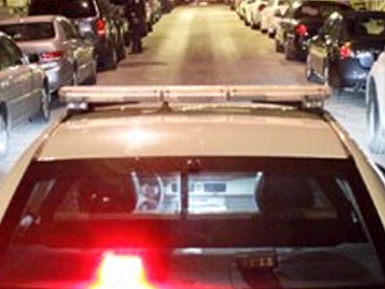 Philadelphia police car on a dimly lit street