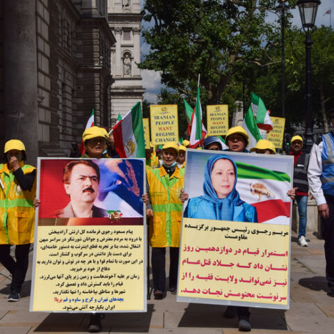Protest against iran president ebrahim raisi, london, uk 3 august 2021. London, united kingdom. 3rd aug 2021. A protester holds a pro-democracy placard with a picture of maryam rajavi. Members of the anglo-iranian community and supporters of the national council of resistance of iran ncri gathered outside downing street to condemn the regime of president ebrahim raisi and to highlight the 1988 massacre of 30,000 political prisoners in iran.