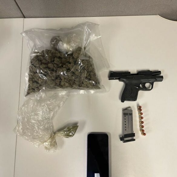Vehicle stop in inner harbor uncovers handgun and active warrant - photo licensed by shore news network.