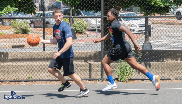 Boston police district d-4 engages in friendly basketball game with local students - photo licensed by shore news network.
