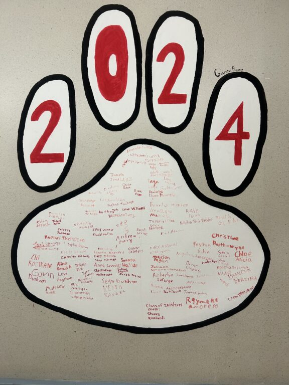 Crawford Rodriguez Kicks Off New Tradition with Paw Print Inspirational Banner