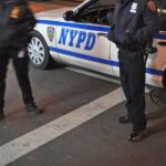 New York City Police Department officers arrive at crime scene.