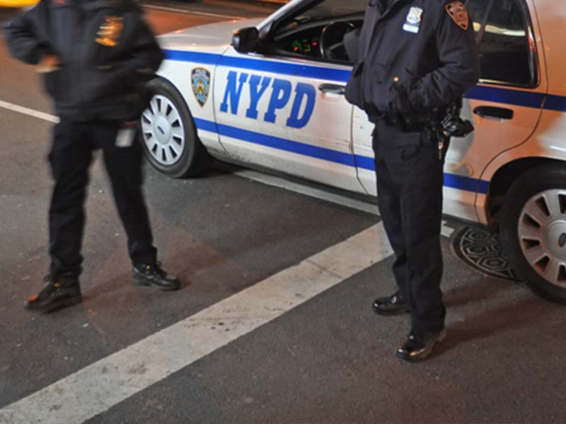 New York City Police Department officers arrive at crime scene.