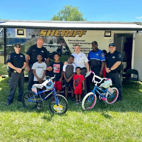 Two children walk away with bikes at juneteenth celebration - photo licensed by shore news network.
