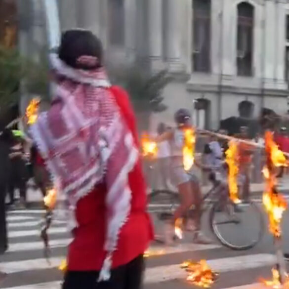 Protesters burn american flag outside philadelphia city hall on 4th of july - photo licensed by shore news network.