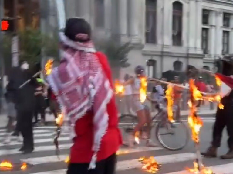 Protesters burn american flag outside philadelphia city hall on 4th of july - photo licensed by shore news network.