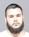 Utica police arrest suspect in shots fired investigation