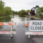 Road closed due to heavy flooding. Use Caution.