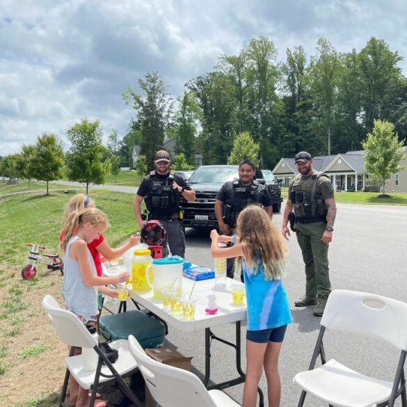 Calvert county deputies celebrate local girls' lemonade stand heroes - photo licensed by shore news network.