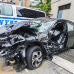 A damaged car inside a NYC Police Department lot - File Photo - Not actual photo from reported incident.