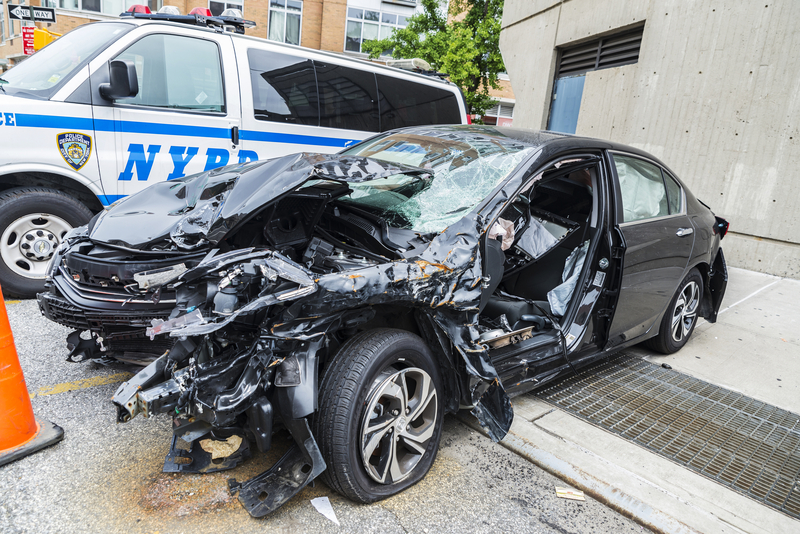 A damaged car inside a NYC Police Department lot - File Photo - Not actual photo from reported incident.
