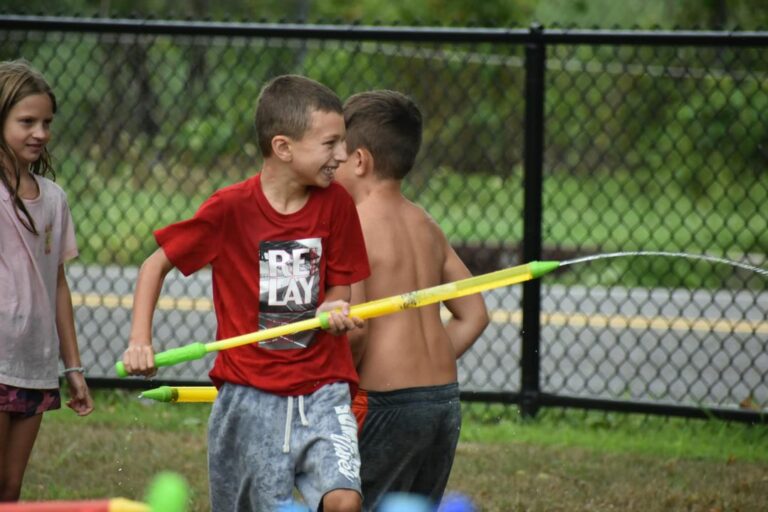 Water gun fight between police, campers ends with multiple smiles - photo licensed by shore news network.