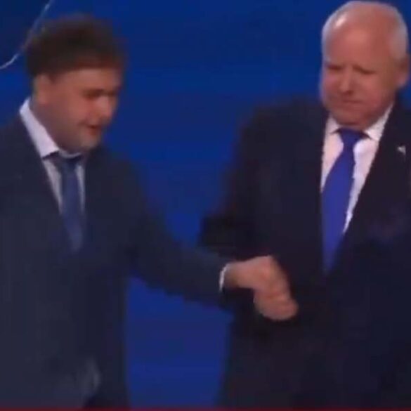 Tim walz, america's favorite dad, forcibly yanks son on dnc stage - photo licensed by shore news network.