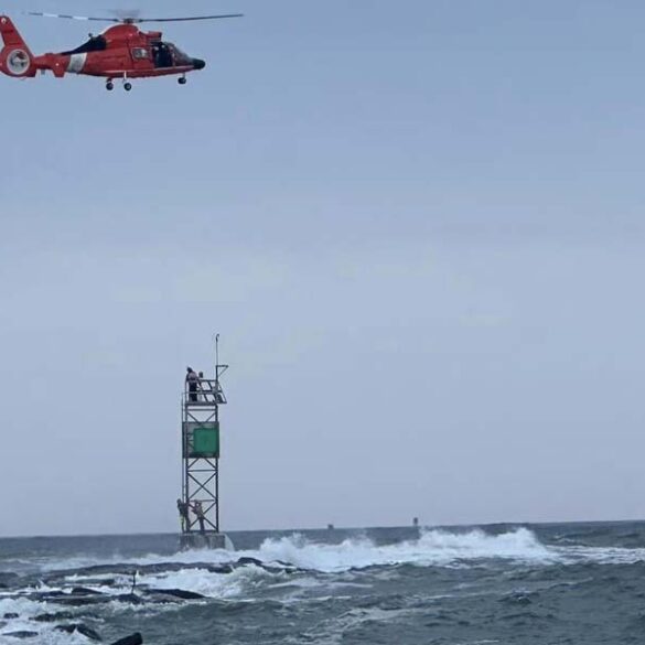 Daring rescue saves two fisherman stranded on the barnegat inlet jetty during passing tropical storm - photo licensed by shore news network.