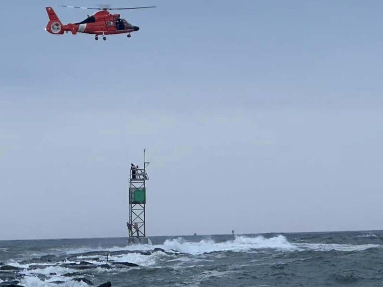 Daring rescue saves two fisherman stranded on the barnegat inlet jetty during passing tropical storm - photo licensed by shore news network.
