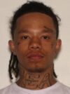 One akron murder suspect arrested, second still at large