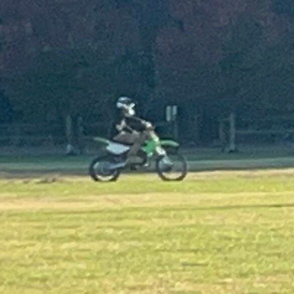 Police seeking to identify dirt bike rider caught on camera riding on fields - photo licensed by shore news network.